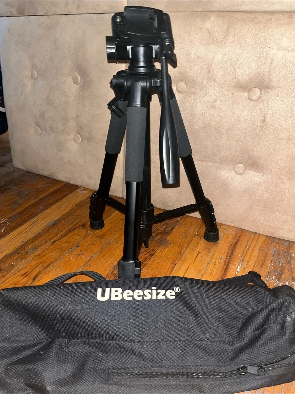 Black Camera Tripod with Foam Grip and Adjustable Head